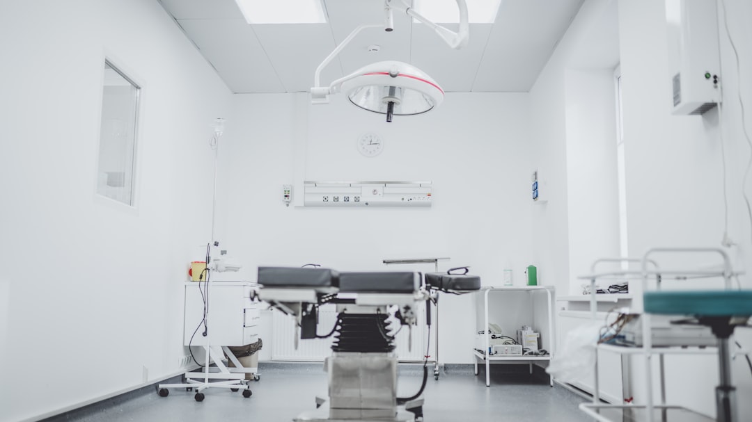black-and-white-hospital-bed-in-the-middle-of-interior-building-de6ryp1naho